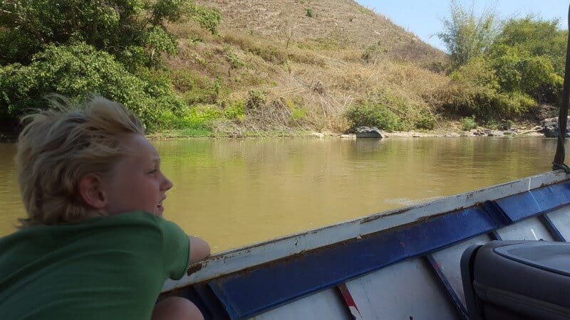 Tai enjoying the boat ride from Thaton to Chiang Rai on the Kok River
